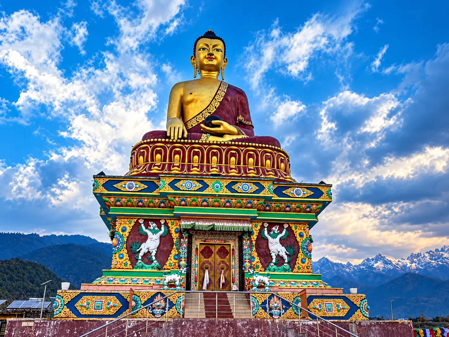 Golden Buddha Shrine Beneath Snowy Peaks